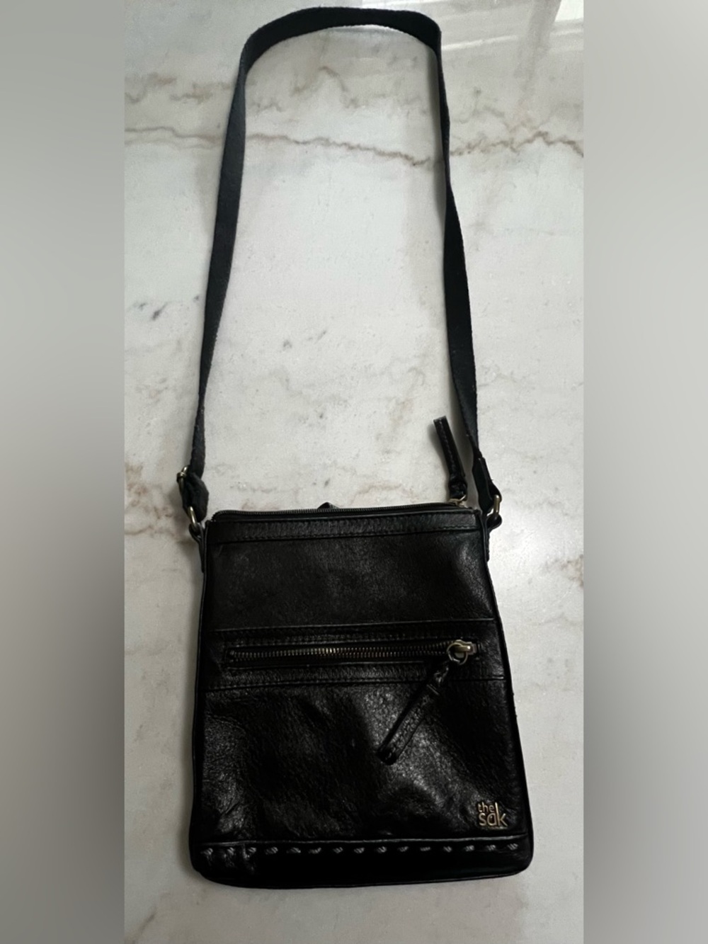 The Sak Black Leather Crossbody Bag with Gold Hardware And Colorful Lining